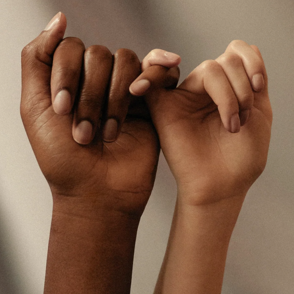 two hands, with the little fingers interlinked